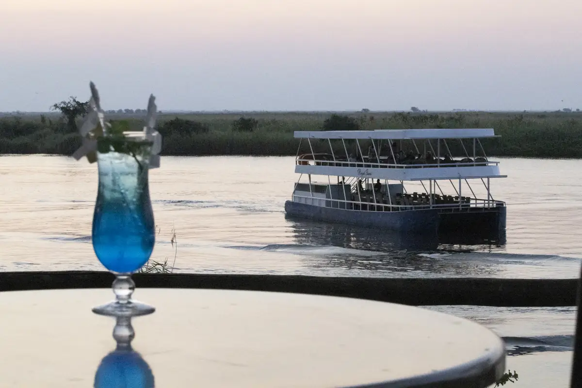 A cocktail on the rail as a cruise boat passes
