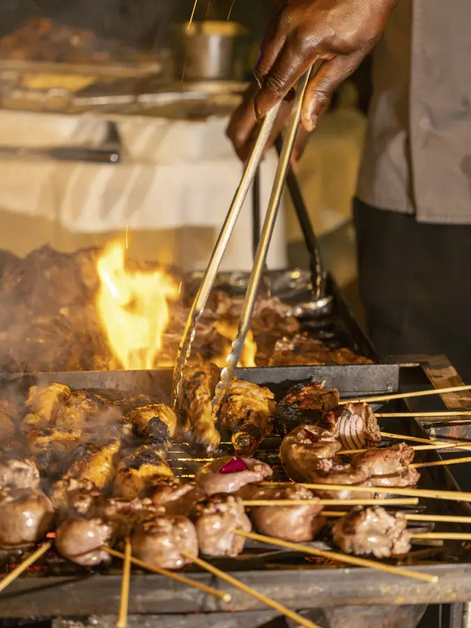 Skewers grilling over an open fire